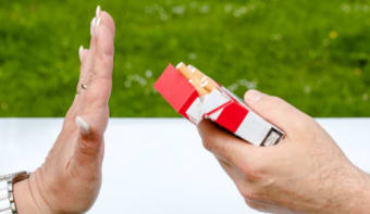 person refusing a cigarette packet